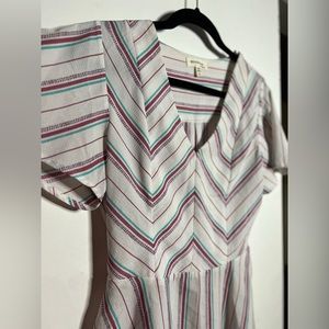 White blouse with colorful stripes size L.